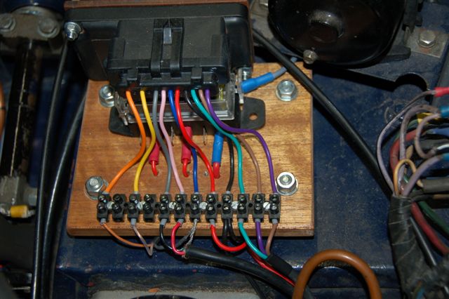 Notice the brown/purple wire switched it over to get another firing sequence from the coil, normally A,C,B with the wires switched it is A,B, C allowing to put the plugleads without crossing (depending of your firingorder of course)